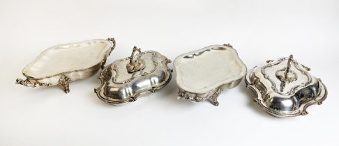 A PAIR OF SILVER PLATED TUREENS AND COVERS, in the Rococo style, plus a pair of warming dishes and