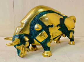 CAST BRONZE FIGURE OF A BULL, 30cm high, 57cm wide, 19cm deep, in charging position gilt metal, with