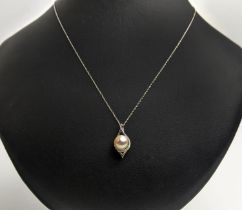 A 9CT WHITE GOLD AND PEARL AND DIAMOND PENDANT NECKLACE, with a single row of diamonds below the