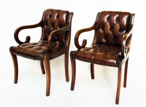 ARMCHAIRS, a pair, Regency style mahogany and brass studded mid brown deep buttoned leather
