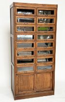 HABERDASHERY CABINET BY DUDLEY & CO, mid 20th century oak with sixteen glazed drawers above two