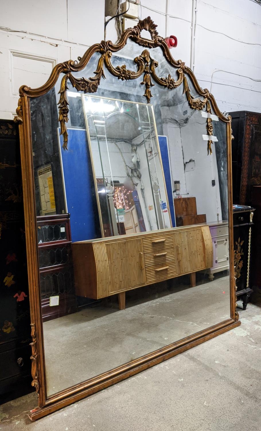 OVERMANTEL MIRROR, 231cm H x 189cm, late 19th/early 20th century giltwood of large proportions