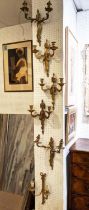 WALL SCONCES, a set of three, Louis XVI style gilt metal with urn detail, each 40cm H x 31cm W, a