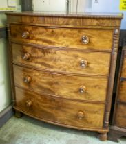 BOWFRONT CHEST, circa 1820, George IV mahogany, four long graduated drawers, applied split turning