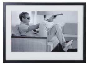 STEVE MCQUEEN WITH A GUN, photographic print, framed and glazed, 54cm x 74cm.