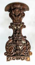 WALL MOUNTED BRACKETS, a pair, hand carved in the Rococo style, with plinth tops supported by scroll