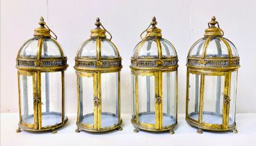 STORM LANTERNS, a set of four, Regency style, gilt metal, 46cm H x 19cm diam. (4)