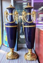 FLOOR STANDING URNS, a pair, Sevres style, blue ceramic with gilt metal mounts, 135cm H each. (2)