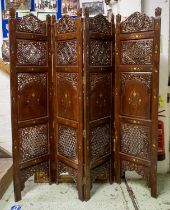 SCREEN, Indian hardwood of four panels with pierced and brass inlaid decoration each leaf, 177cm H x