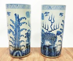 STICK STANDS, a pair, Chinese export style blue and white ceramic, 60cm H x 20cm diam approx. (2)