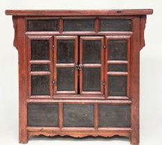 CHINESE CABINET, 19th century scarlet firwood framed enclosing faint gilt decorated black lacquer