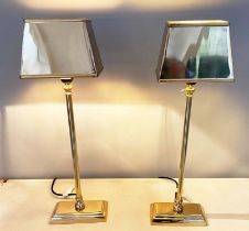 LIBRARY TABLE LAMPS, a pair, square shades, turned columns, square bases, gilt metal finish, 60cm