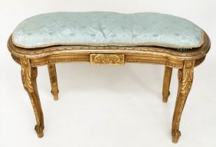 WINDOW SEAT, early 20th century French transitional style giltwood of kidney form with cane seat and