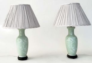 TABLE LAMPS, a pair, Celadon ceramic with foliate decoration of vase form with silk pleated