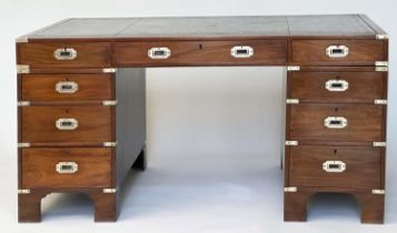 CAMPAIGN STYLE DESK, mahogany and brass bound with tooled leather writing surface above nine drawers