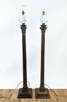 STANDARD LAMPS, a pair, each 138cm H, with fluted wooden columns and metal mounts.