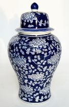 TEMPLE JAR, Chinese white and indigo blue ceramic of lidded vase form, 53cm H.