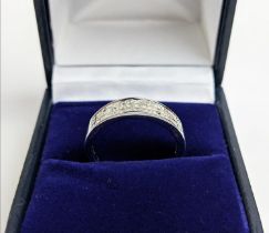 AN 18CT WHITE GOLD DIAMOND RING, with 45 invisible set princess cut diamonds in three rows, total