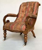 ARMCHAIR, 19th century mahogany framed, buttoned paisley upholstery, with scroll arms and ceramic