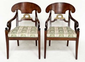 ARMCHAIRS, a pair, Empire design walnut and parcel gilt each with carved wreath centre and