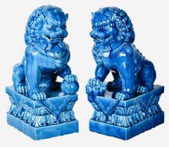 FOO DOGS, a pair, 40cm high, 15cm wide, 25cm deep, cobalt blue glazed ceramic. (2)