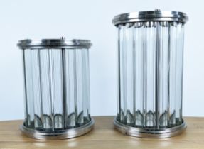 STORM LANTERNS, a graduated pair, polished metal, with glass rods, 40.5cm x 26.5cm diam. at largest.