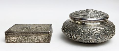 A BURMESE WHITE METAL BOWL AND COVER, late 19th / early 20th Century, embossed with figures in