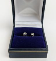 A PAIR OF 9CT WHITE GOLD DIAMOND SOLITARE STUDS, each diamond with an approx weight of 0.16