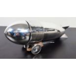 COCKTAIL SHAKER, 32cm x 9cm x 13cm, in the form of a Zeppelin, polished metal.