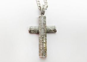 AN 18CT WHITE GOLD AND DIAMOND SET CROSS PENDANT, the pendant set with approx 194 pave set