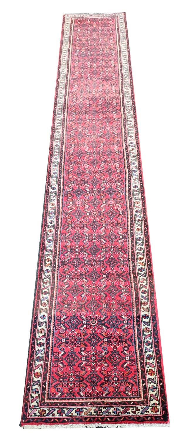 LARGE PERSIAN HOSSEINABAD CRIMSON GROUND RUNNER, 514cm L x 84cm W. - Image 2 of 14