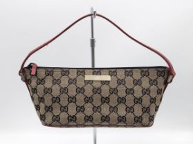 GUCCI VINTAGE POCHETTE BAG, monogrammed canvas with red top leather handle and trims, top zippered