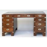 CAMPAIGN STYLE DESK, mahogany and brass bound with tooled leather writing surface above nine drawers