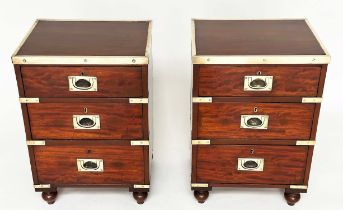 CAMPAIGN CHESTS, a pair, mahogany and brass bound each with three drawers and turned supports,