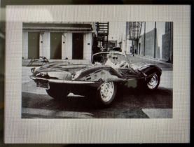 'STEVE MCQUEEN IN HIS JAGUAR', photographic print, framed and glazed, 63cm x 83cm.