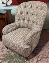 ARMCHAIR, Victorian button back with turned front supports and castors, 93cm H x 69cm W.