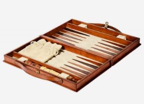 BACKGAMMON SET in brown leathered case, 7cm x 23cm x 40cm.