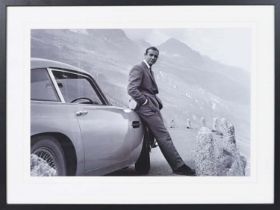 SEAN CONNERY AS JAMES BOND WITH ASTON MARTIN, photographic print, framed, 63cm x 83cm.