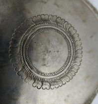 A COLLECTION OF BURMESE/EASTERN SILVER PLATED ITEMS, comprising four heavily embossed bowls and a