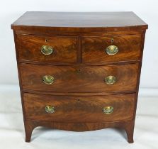 BOWFRONT CHEST, 91cm high, 84cm wide, 51cm deep, Regency mahogany of four drawers.