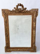 WALL MIRROR, late 19th century French giltwood and gesso moulded with flambeau and quiver ribbon