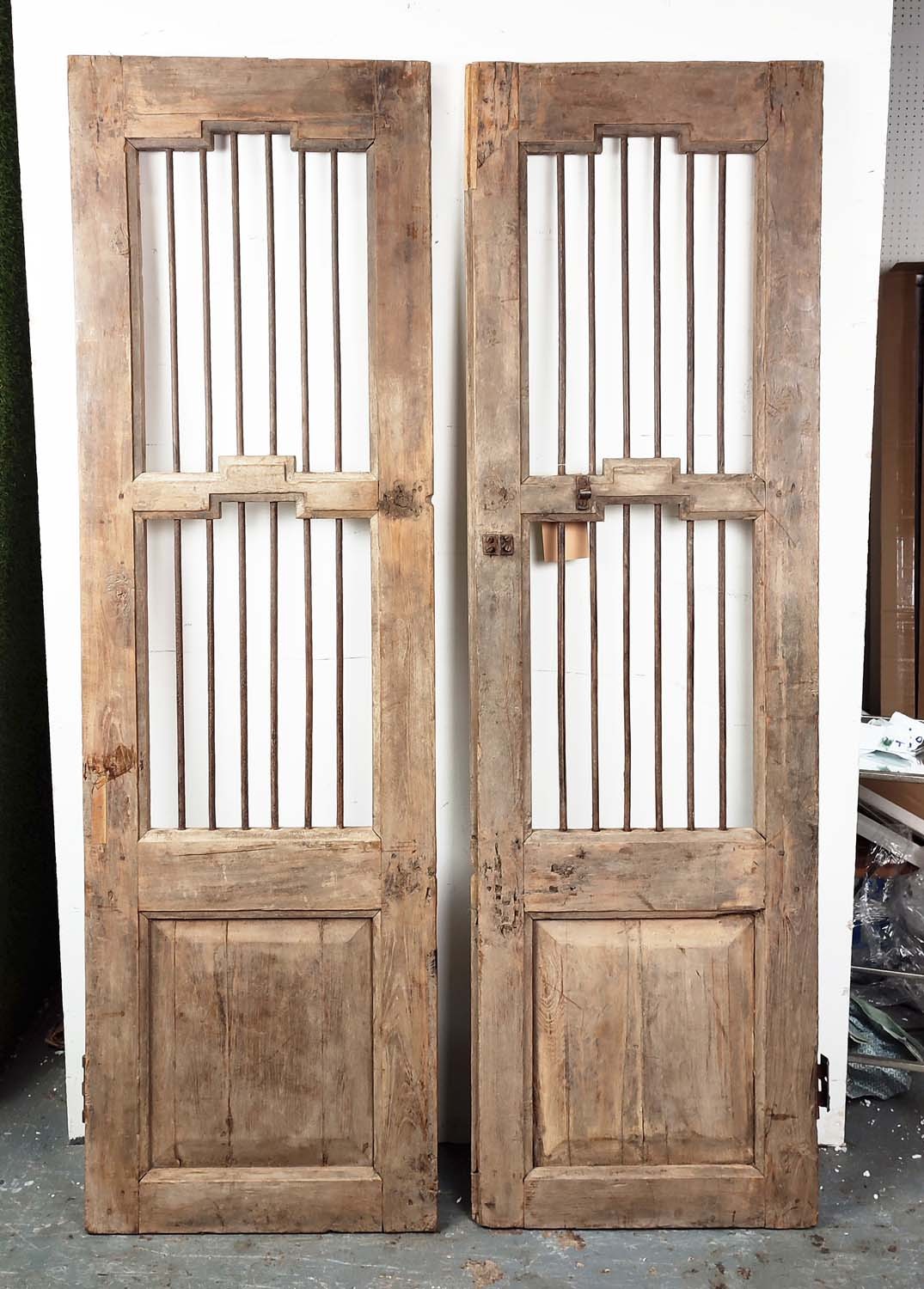 FRENCH WOODEN GATES, a pair, each with iron rod inserts and a single wooden panel, probably 19th