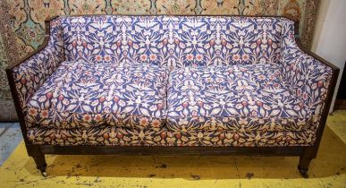 SOFA, 91cm H x 178cm W x 80cm D, George IV, mahogany in blue foliate upholstery on brass castors.