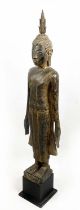 STANDING BUDDHA, hand carved giltwood on stand, 145cm H.