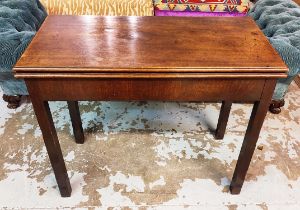 A GEORGE III MAHOGANY CARD TABLE, circa 1770, fold over top, inset green baize, secret drawer,