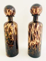 DECANTERS, a pair, 40cm high, 10cm diameter, Murano style tortoiseshell glass. (2)
