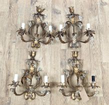 WALL LIGHTS, a set of four, Rococo style, each of two-branch form, gilt metal with glass droplets,