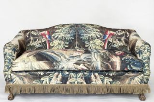 SOFA, early 20th century with camel back, French tapestry print upholstery and carved claw and