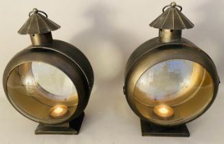 STORM LANTERNS, a pair, convex glass, bronzed metal, 54cm x 37cm x 26cm. (2)