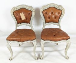 DINING CHAIRS, a set of six, with distressed painted carved showframes and stuffover leather